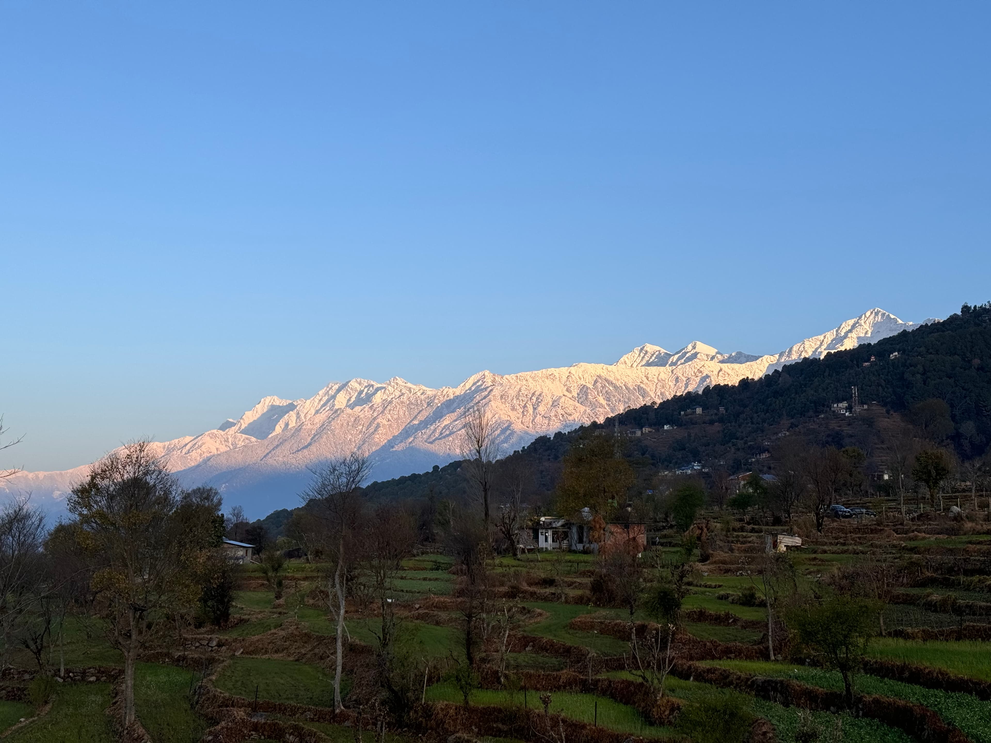 Bedroom with windows overlooking mountains