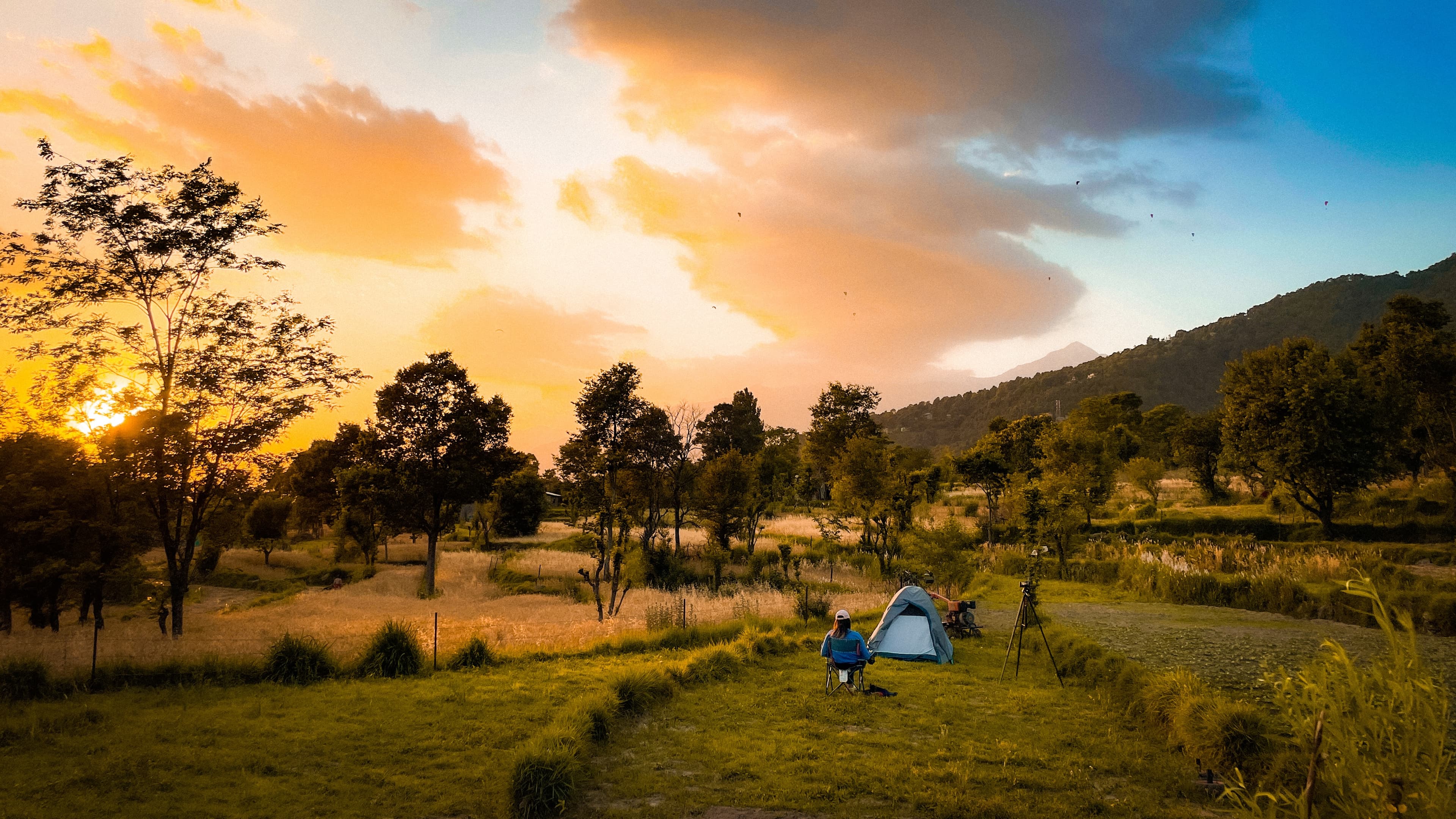 Snow-capped peaks with autumn-colored trees