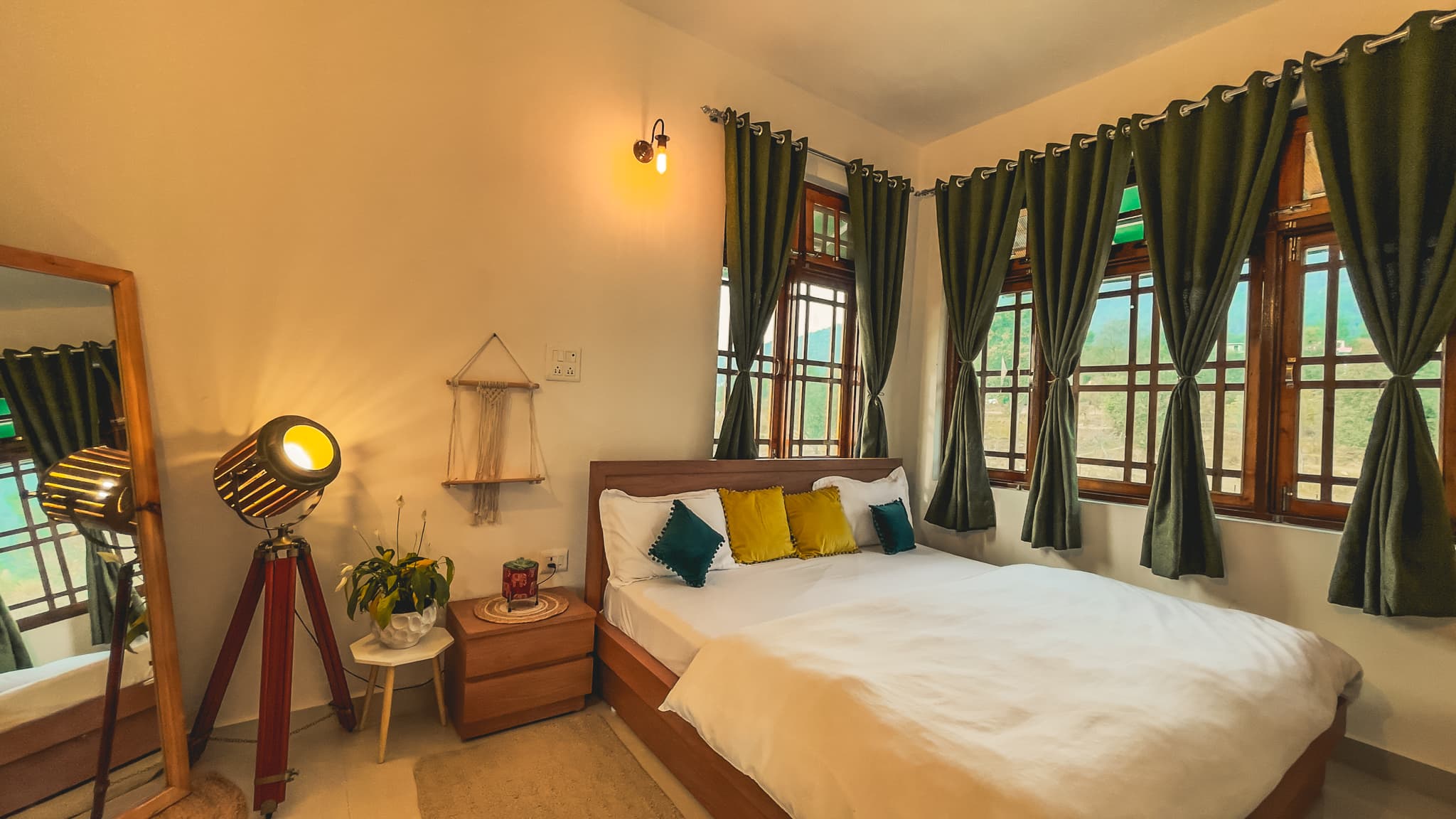 Rainbow over mountains and valley with terraced fields