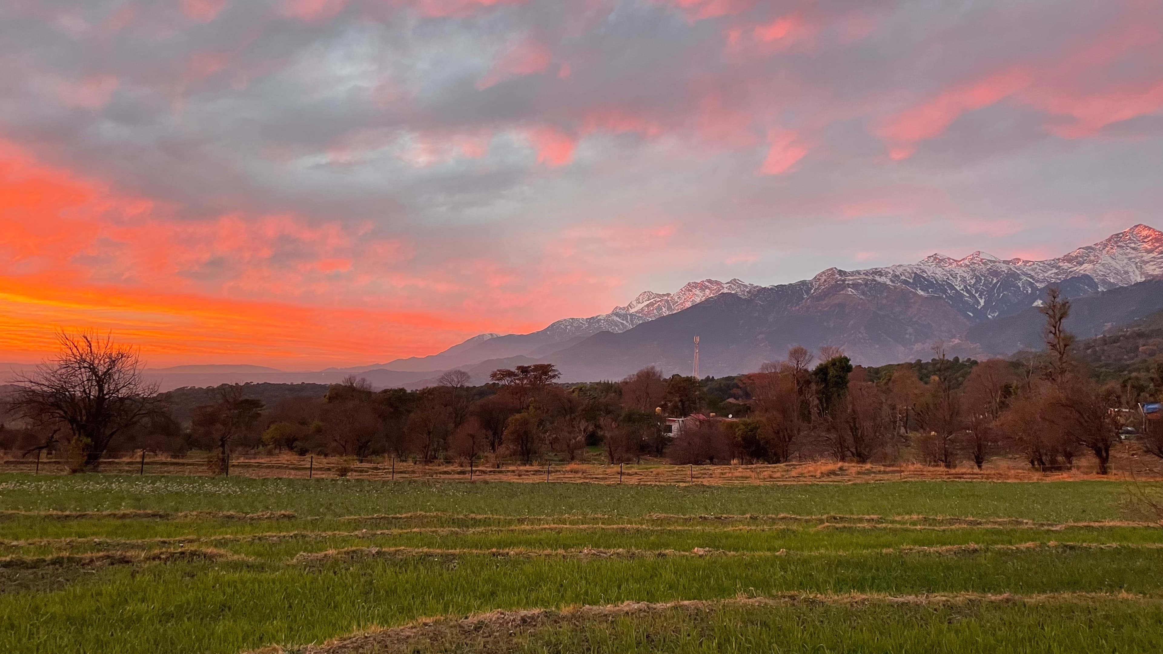Snow-capped mountains with terraced valley fields